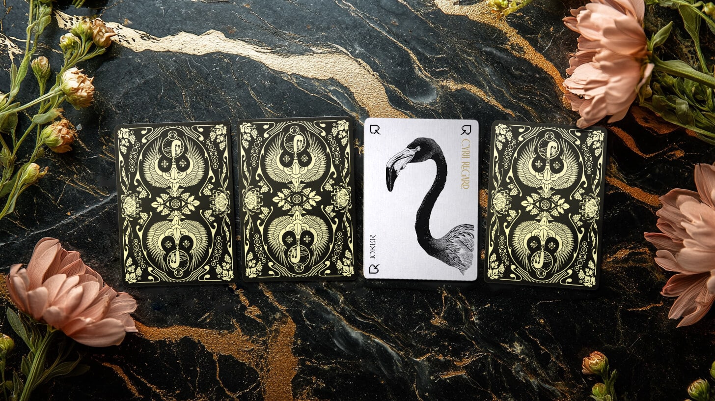 Card backs and the flamingo card of Cyril Regard's Flamingo playing card deck